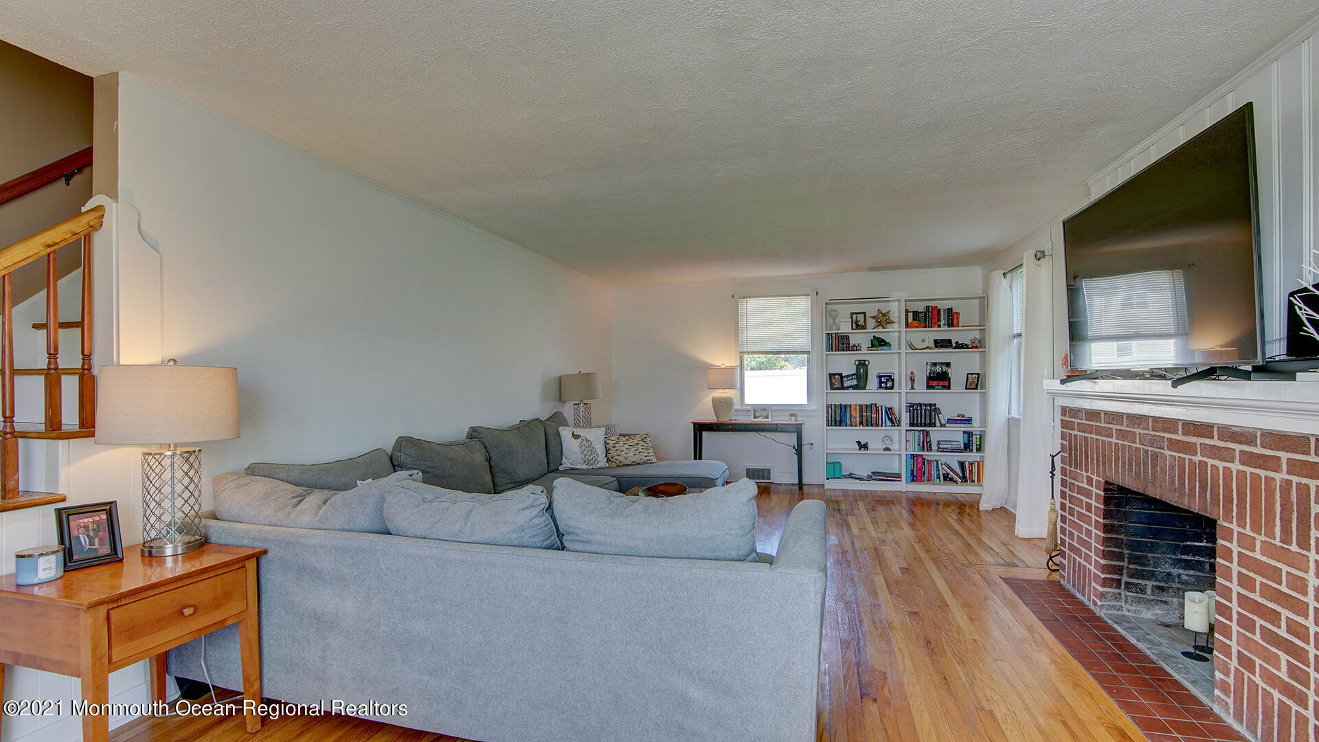 102 Wilburtha Road Ewing, NJ 08628 - Photo 14 of 30 a living room with furniture a flat screen tv and a fireplace
