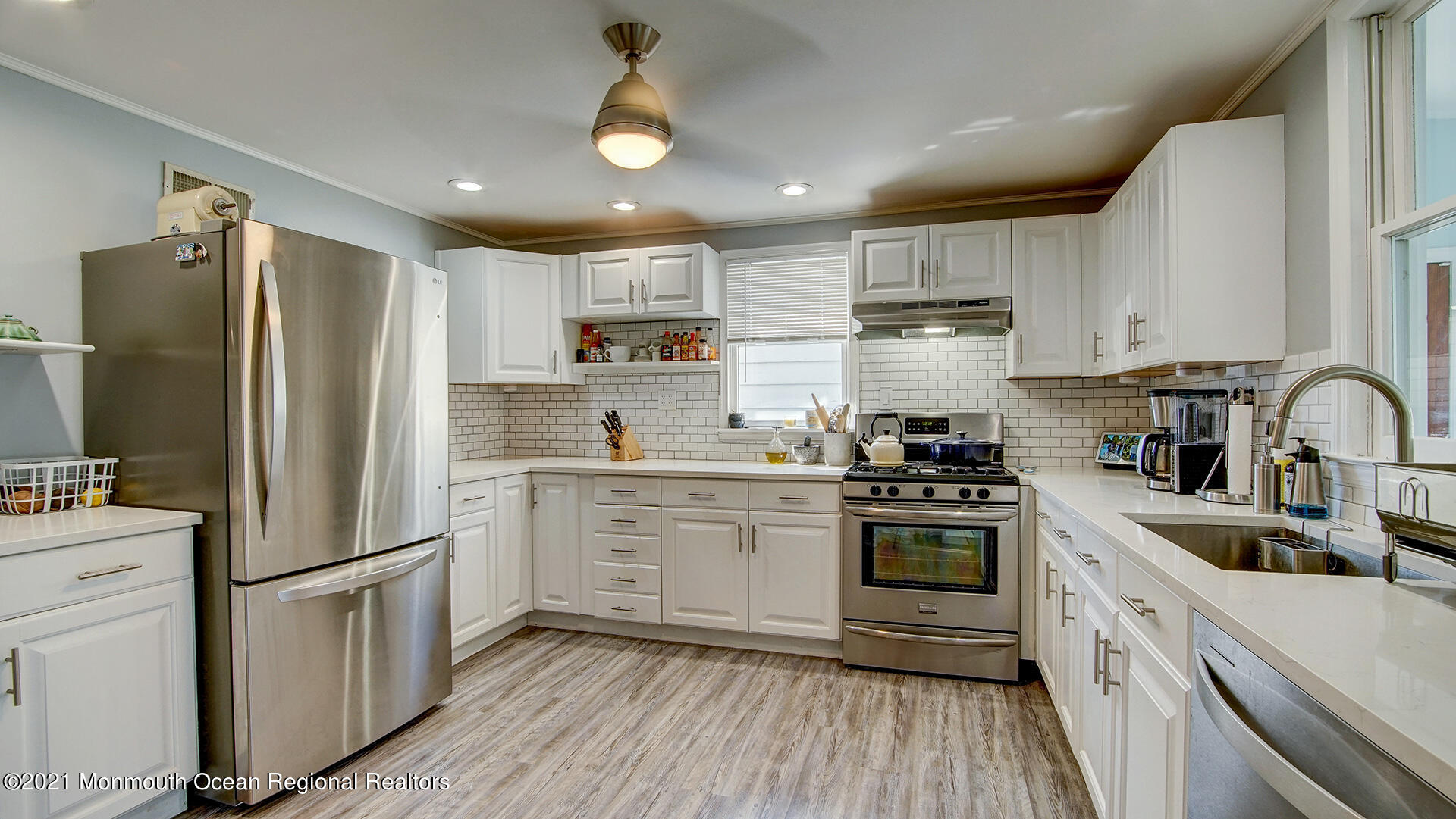 102 Wilburtha Road Ewing, NJ 08628 - Photo 18 of 30 a kitchen with white cabinets stainless steel appliances and sink