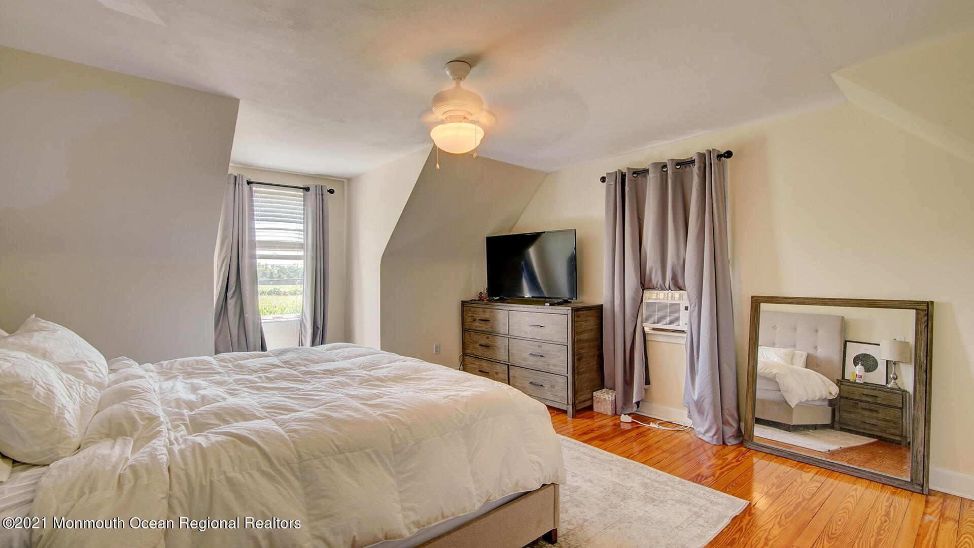 102 Wilburtha Road Ewing, NJ 08628 - Photo 24 of 30 a bedroom with a bed and a flat screen tv