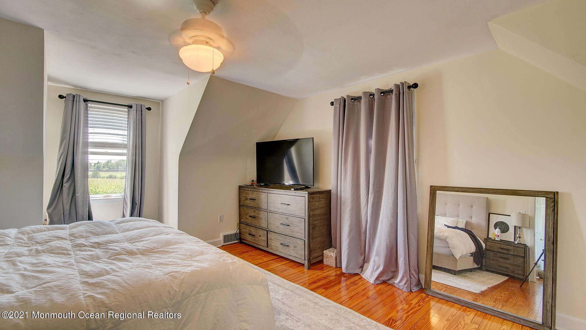 102 Wilburtha Road Ewing, NJ 08628 - Photo 28 of 30 a bedroom with a bed and a chandelier