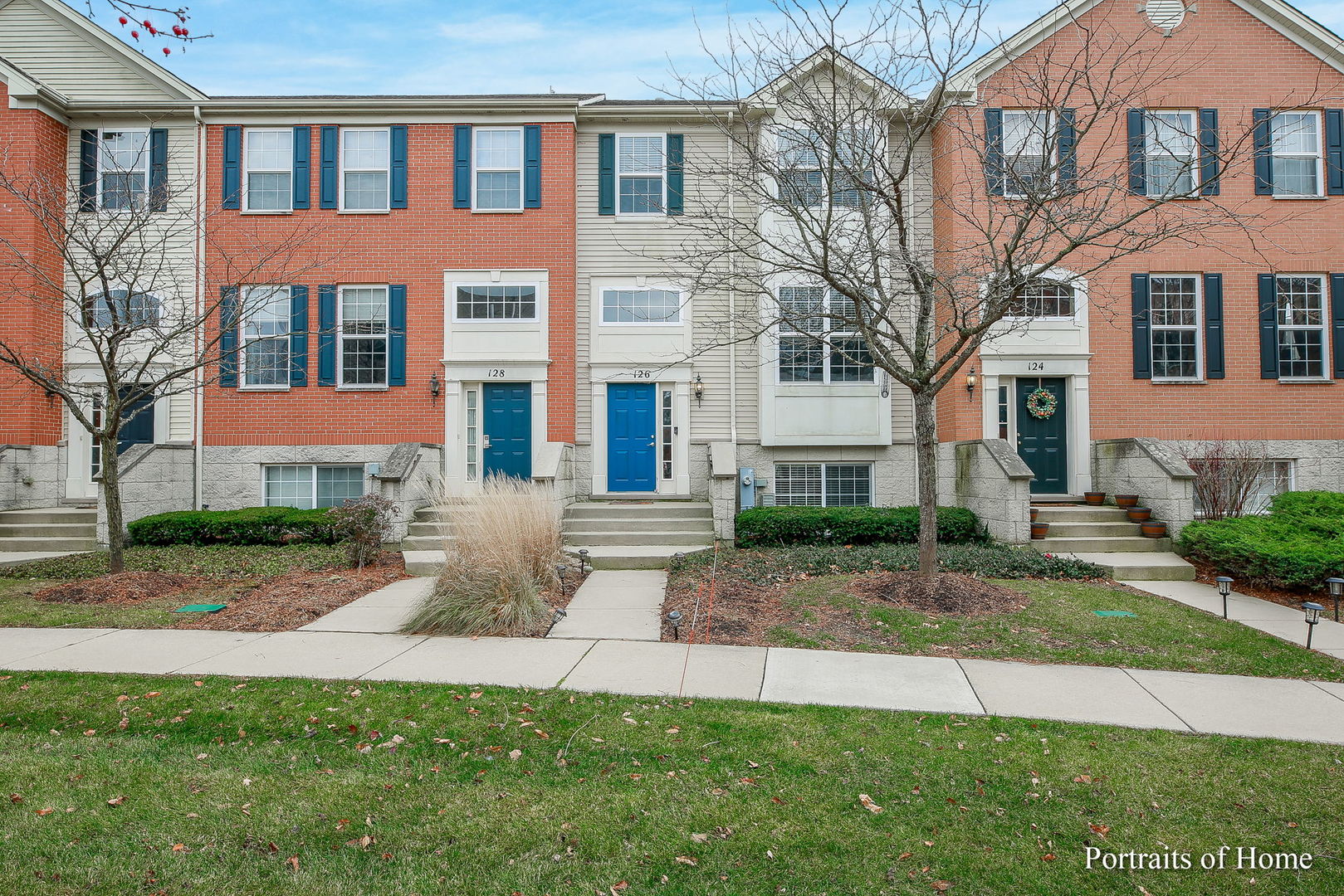 a front view of a house with a yard