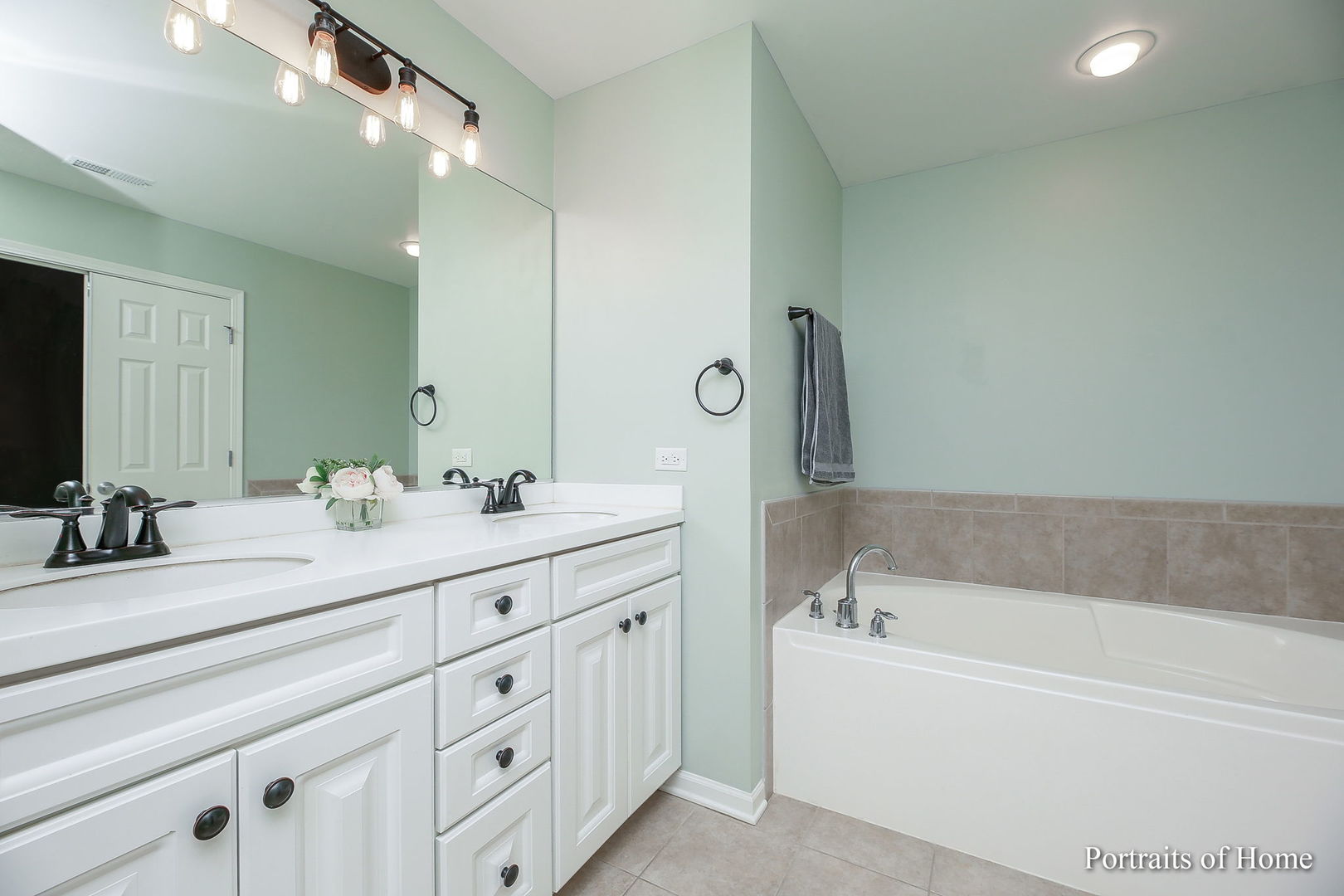 126 Jackson Street Gilberts, IL 60136 - Photo 16 of 25 a spacious bathroom with a double vanity sink mirror and bathtub