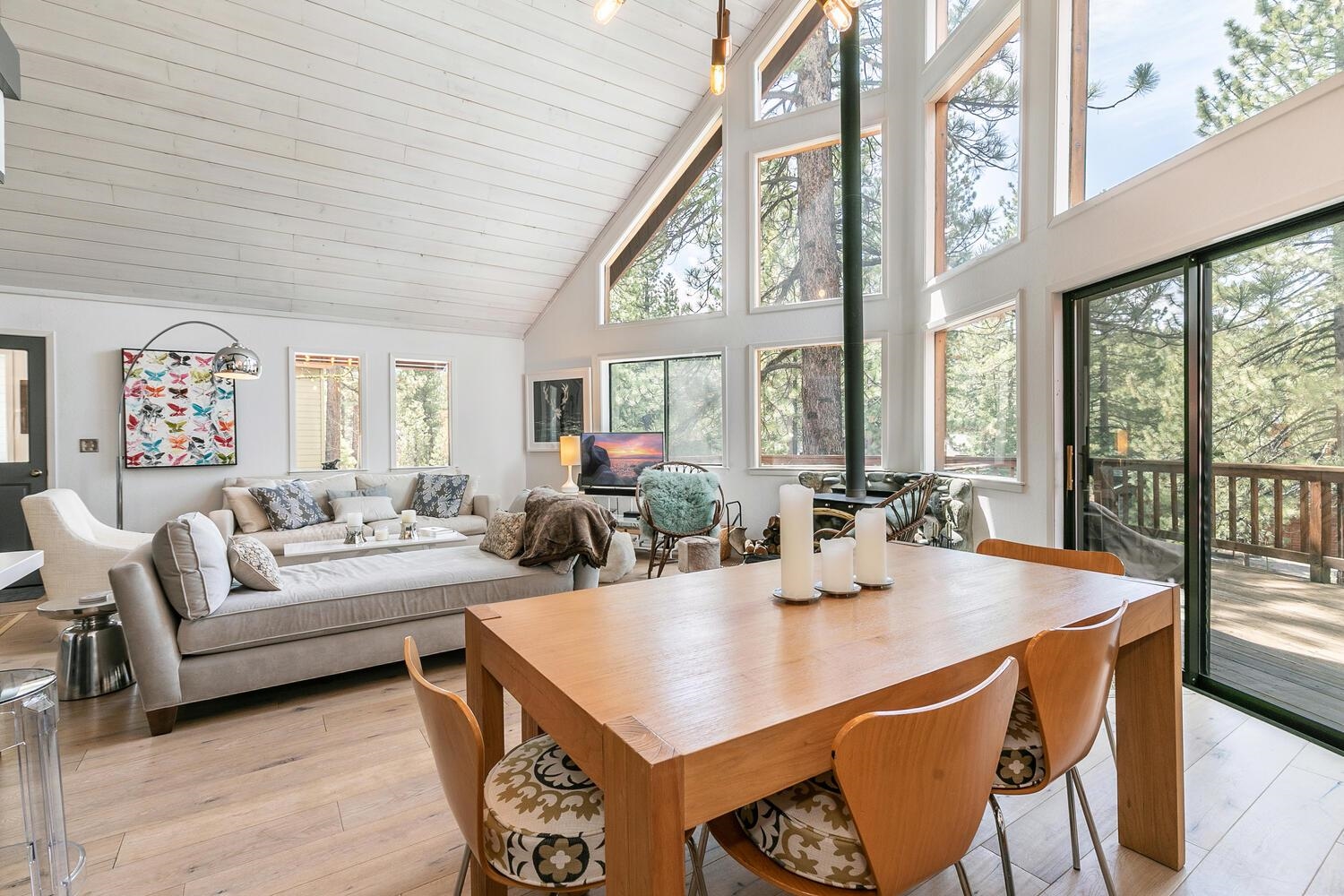 a view of a dining room with furniture large windows and wooden floor