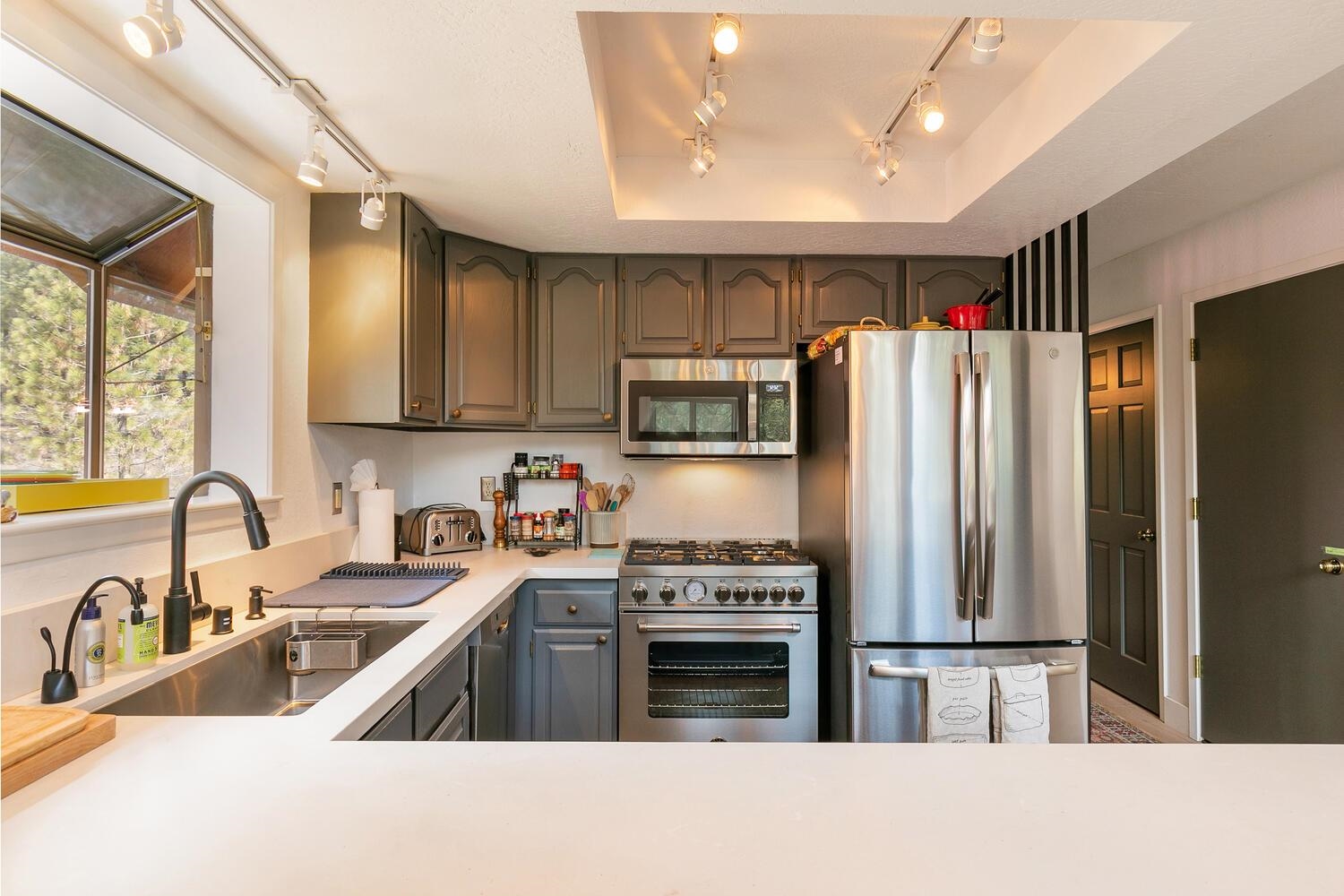 326 Skidder Trail Truckee, CA 96161 - Photo 9 of 21 a kitchen with stainless steel appliances granite countertop a refrigerator sink and stove