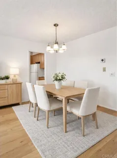 a dining room with furniture and window