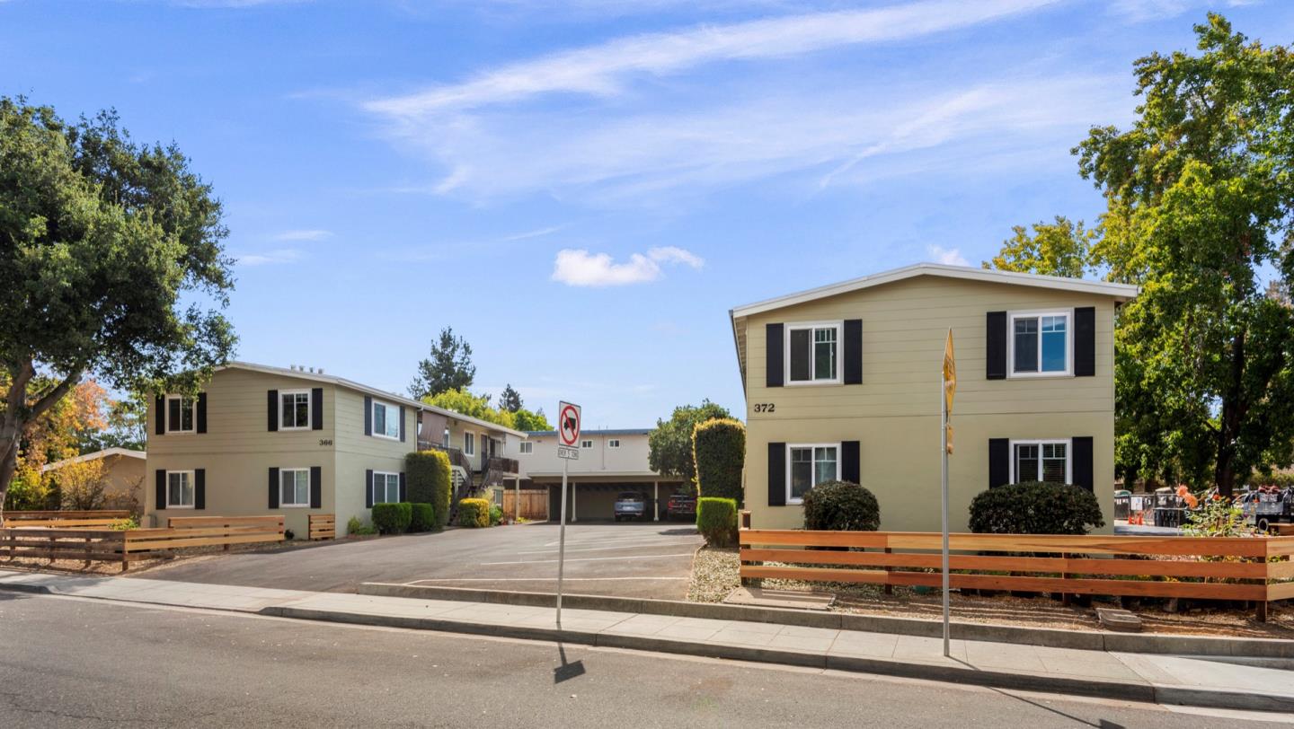 a view of street along with house and trees