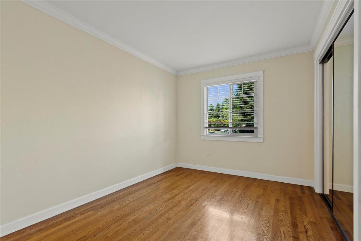 366 Camille Court Mountain View, CA 94040 - Photo 14 of 72 a view of an empty room with wooden floor and a window
