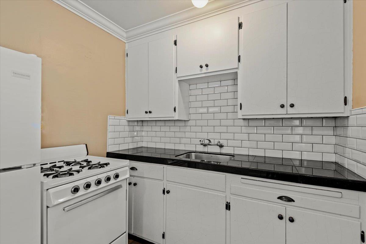 366 Camille Court Mountain View, CA 94040 - Photo 18 of 72 a kitchen with white cabinets and appliances