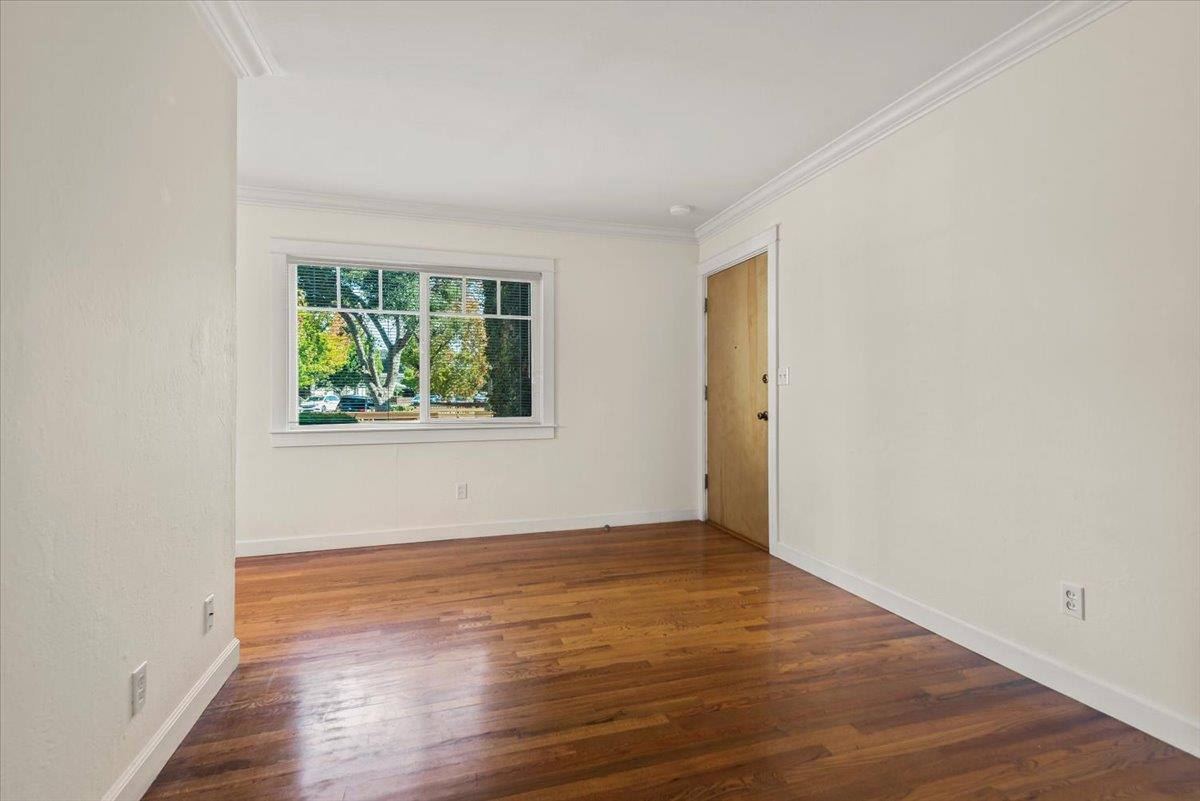 366 Camille Court Mountain View, CA 94040 - Photo 23 of 72 an empty room with wooden floor and window