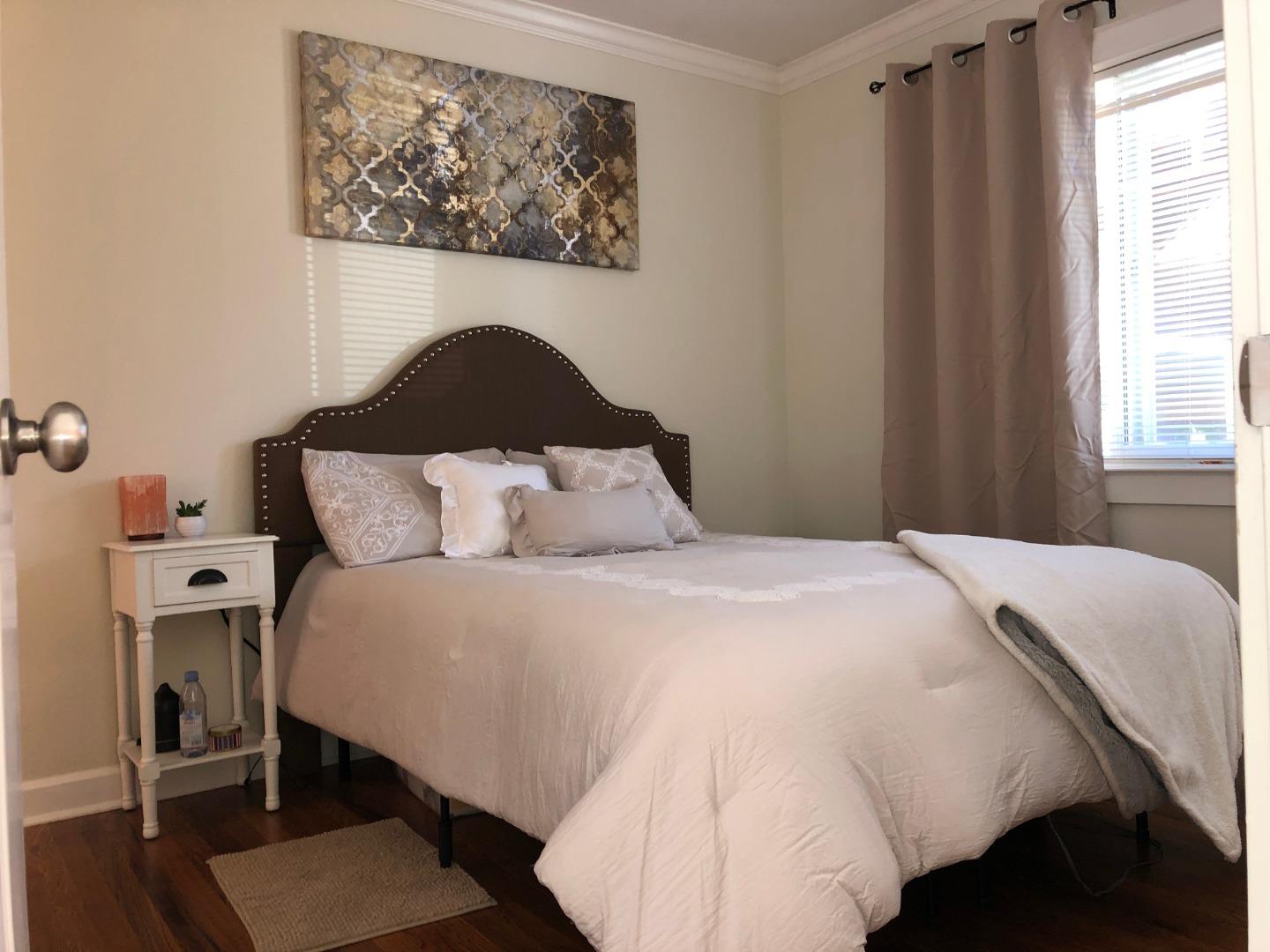 366 Camille Court Mountain View, CA 94040 - Photo 32 of 72 a bedroom with a bed and a painting on the wall