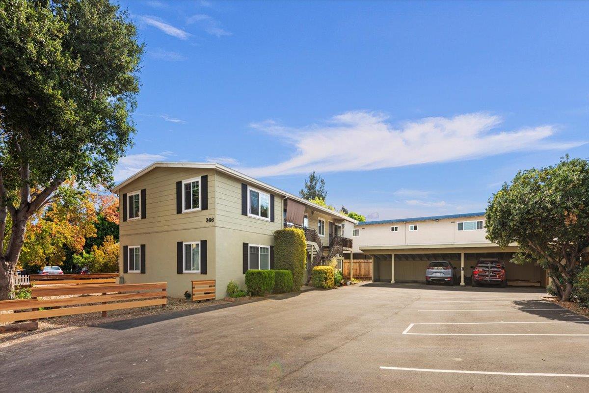 366 Camille Court Mountain View, CA 94040 - Photo 44 of 72 a view of a white house with a large space and a car parked in front of it