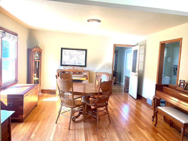 906 South Chamberlain Road Esmond, IL 60129 - Photo 4 of 19 a view of a dining room with furniture and wooden floor
