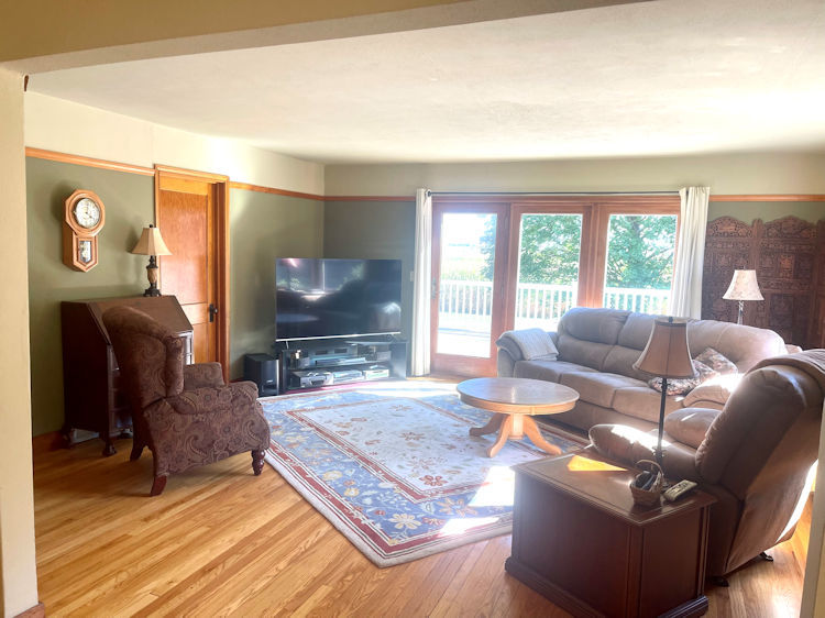 906 South Chamberlain Road Esmond, IL 60129 - Photo 6 of 19 a living room with furniture and a flat screen tv