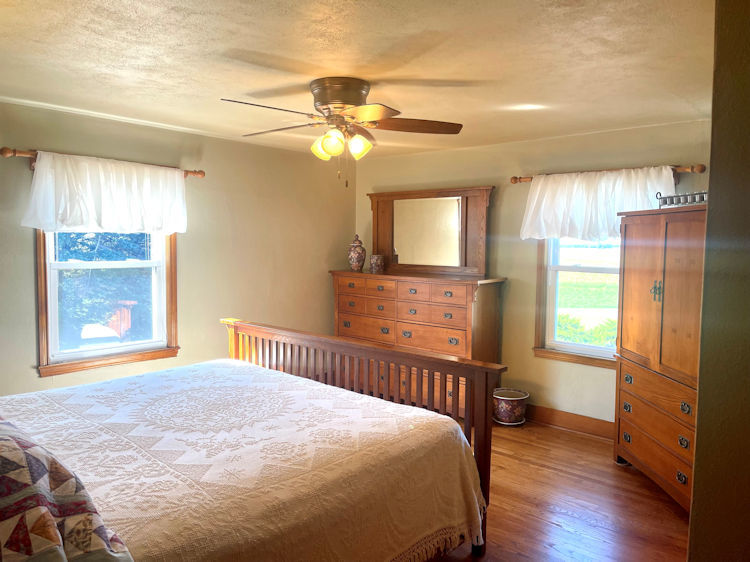 906 South Chamberlain Road Esmond, IL 60129 - Photo 7 of 19 a bedroom with a bed and a window