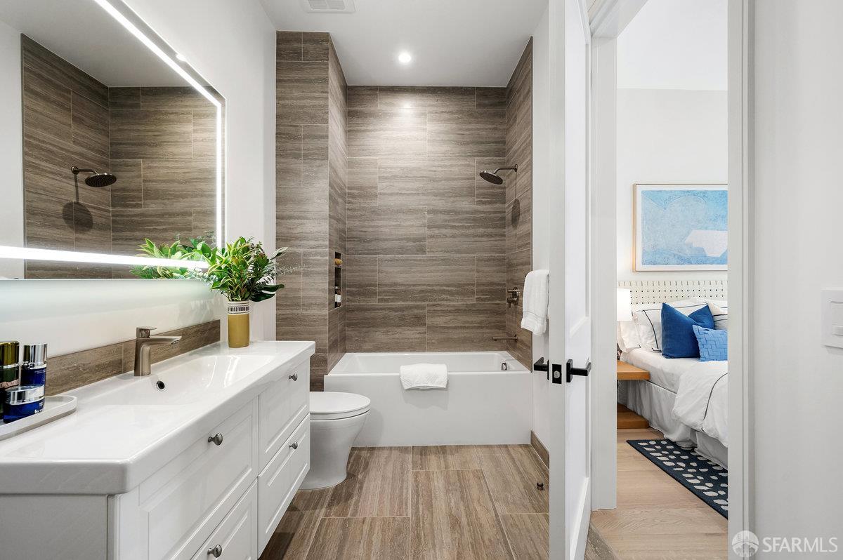 150 Eureka Street, Unit A San Francisco, CA 94114 - Photo 25 of 60 a bathroom with a sink a toilet a mirror and shower