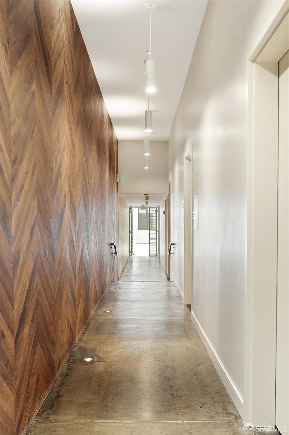 150 Eureka Street, Unit A San Francisco, CA 94114 - Photo 32 of 60 a view of a hallway with wooden floor