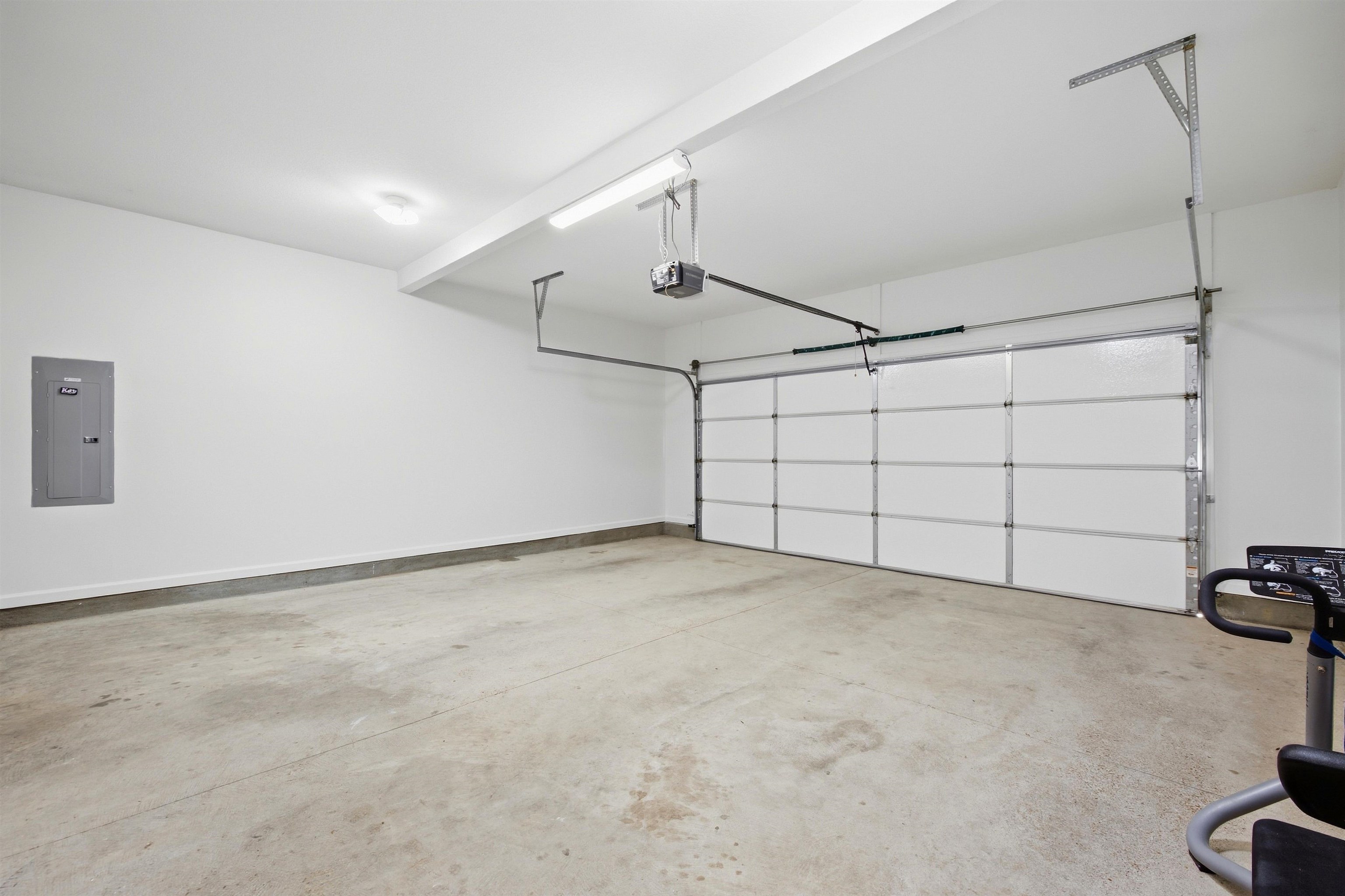 7920 Pips Ridge Lane Bartlett, TN 38133 - Photo 34 of 40 Bright garage space featuring a paneled garage door with an automatic opener