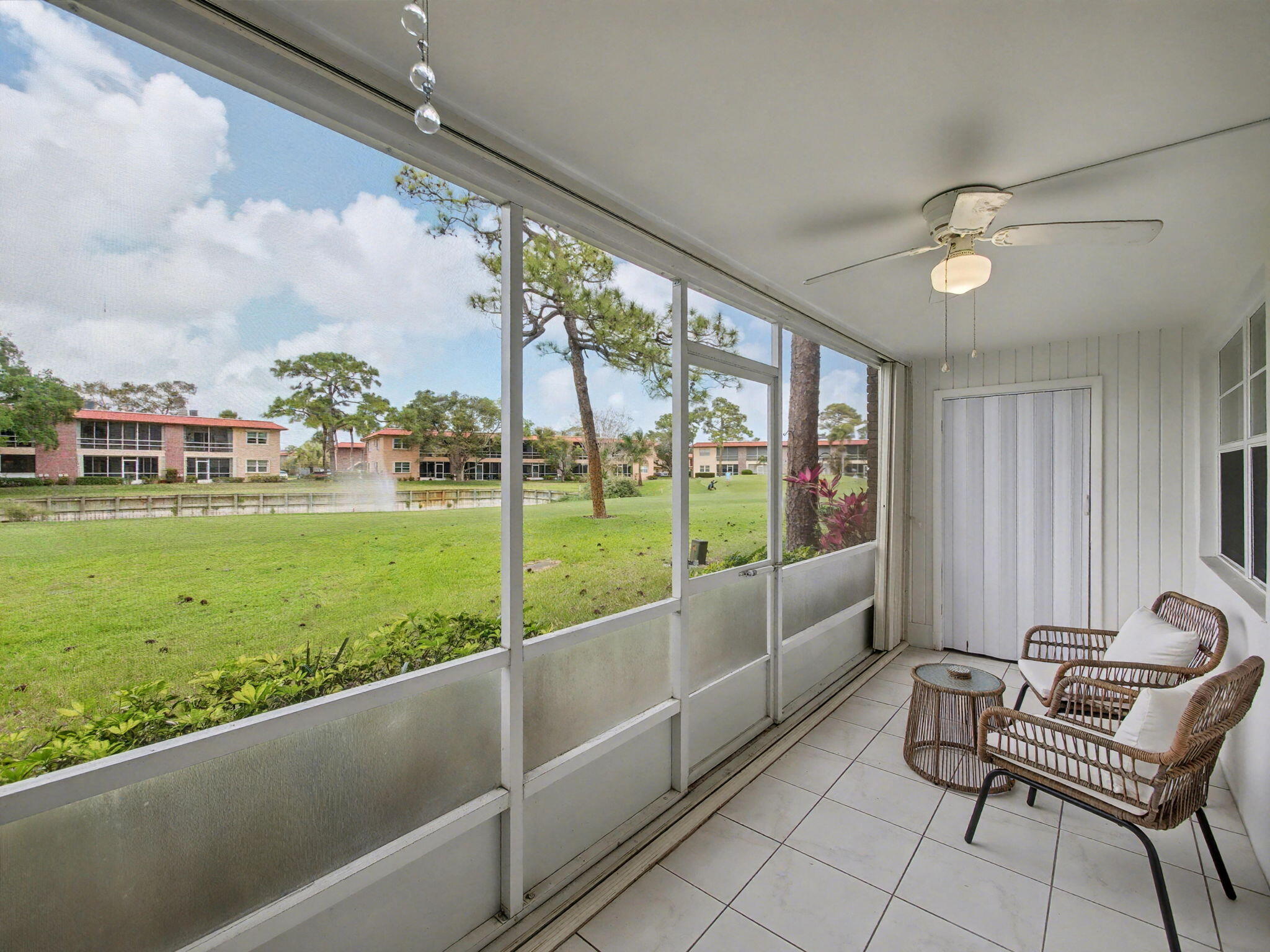 1967 Southwest Palm City Road, Unit 34C Stuart, FL 34994 - Photo 3 of 25 a view of a porch with furniture and garden view