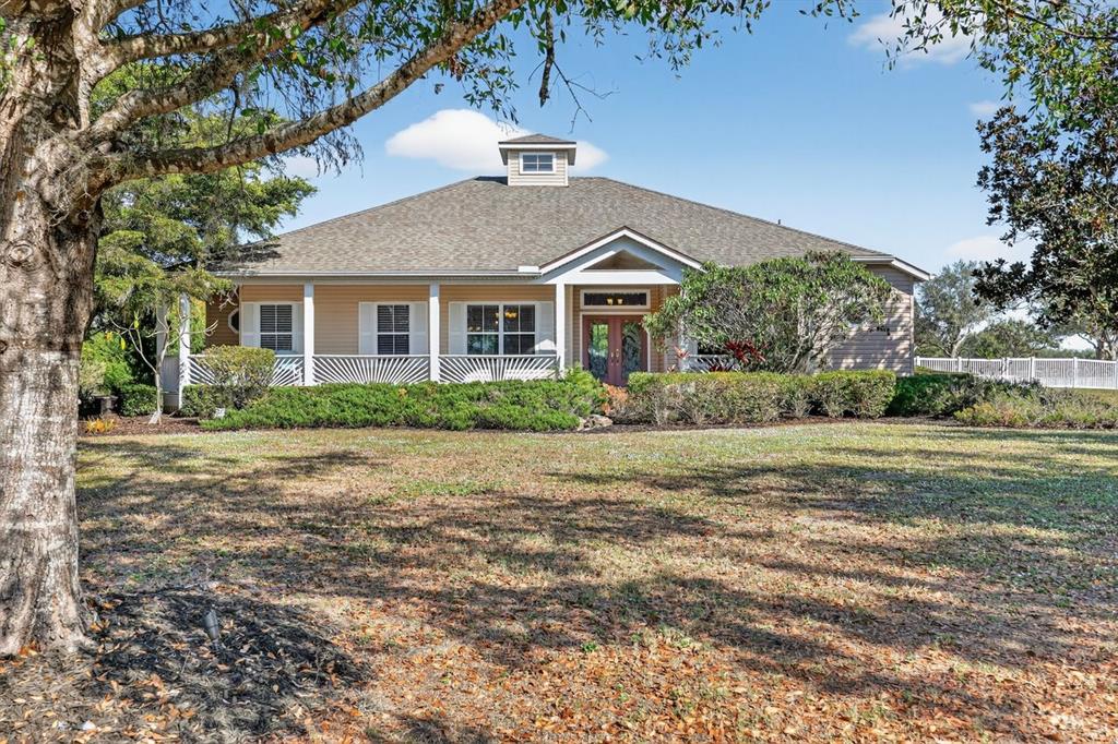 17312 Howling Wolf Run Parrish, FL 34219 - Photo 1 of 41 a front view of a house with a yard