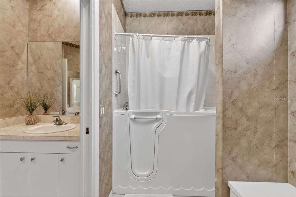 17312 Howling Wolf Run Parrish, FL 34219 - Photo 27 of 41 a bathroom with a sink a toilet and shower