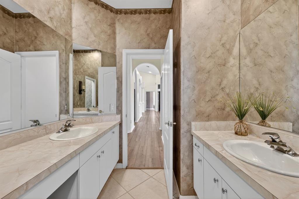 17312 Howling Wolf Run Parrish, FL 34219 - Photo 28 of 41 a bathroom with a double vanity sink mirror and