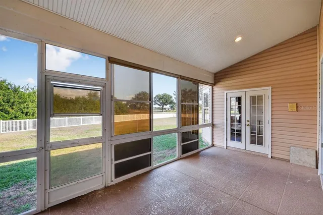 a view of an empty room with a large window