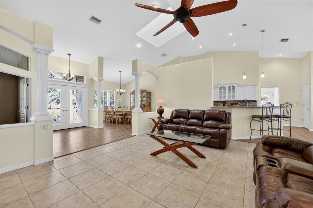 17312 Howling Wolf Run Parrish, FL 34219 - Photo 6 of 41 a living room with furniture and a view of kitchen