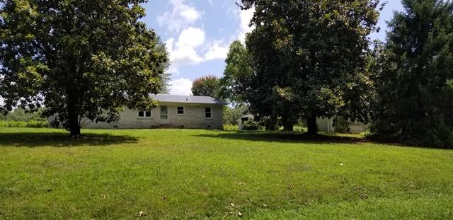 6775 Fall River Road Leoma, TN 38468 - Photo 1 of 26 a front view of a house with garden