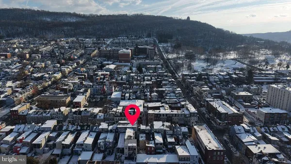 an aerial view of a house with outdoor space