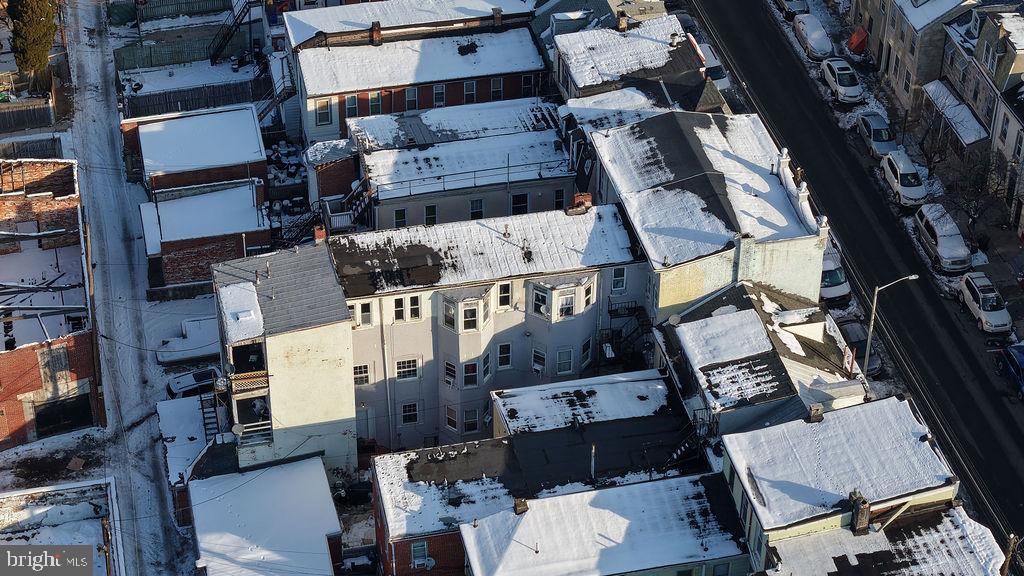 226 North 10th Street Reading, PA 19601 - Photo 18 of 56 Urban rooftops blanketed in winter snow.