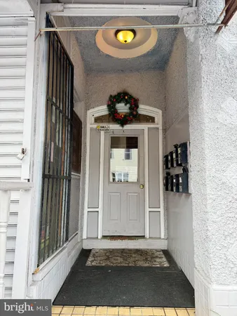 a view of a door and a window in the house
