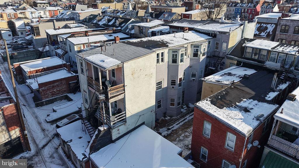 226 North 10th Street Reading, PA 19601 - Photo 23 of 56 Urban rooftops blanketed in winter snow.