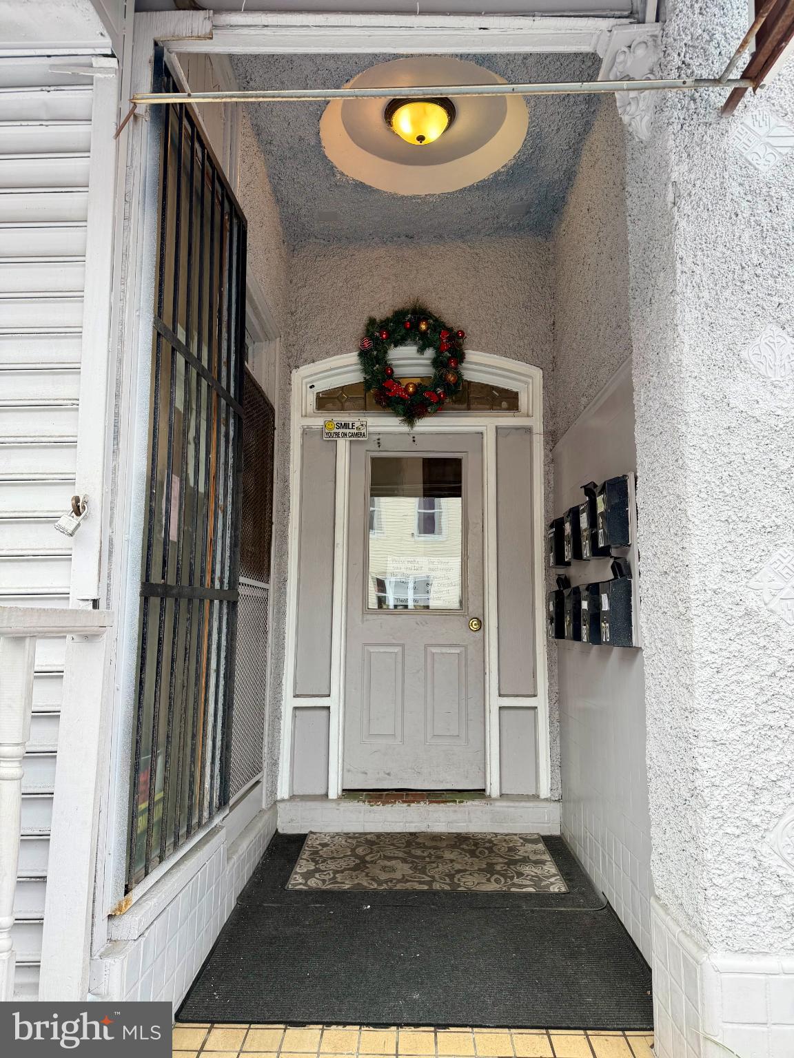 226 North 10th Street Reading, PA 19601 - Photo 4 of 56 Charming entrance adorned with festive wreath.