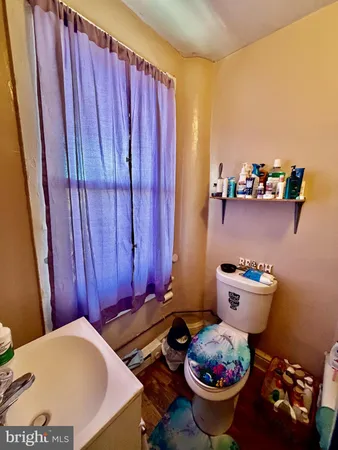 a bathroom with a sink a mirror and shower