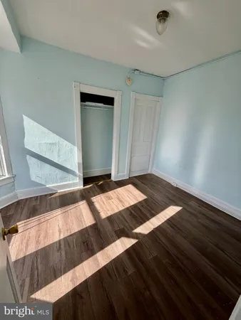 a bathroom with a sink toilet and window
