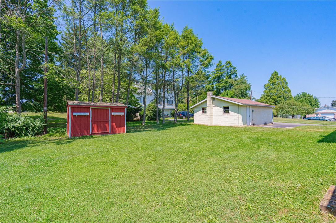 4165 East Texas Road Allentown, PA 18103 - Photo 51 of 56 A spacious, well-maintained yard provides ample outdoor living space, accompanied by two practical outbuildings for storage.