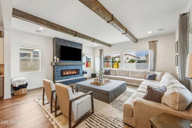 a living room with fireplace furniture and a flat screen tv