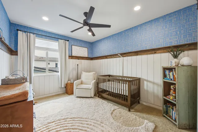 a bedroom with furniture and a rug