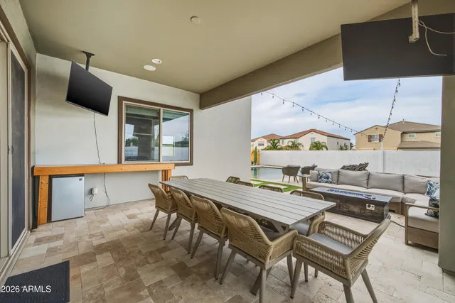 a kitchen with a table and chairs in it