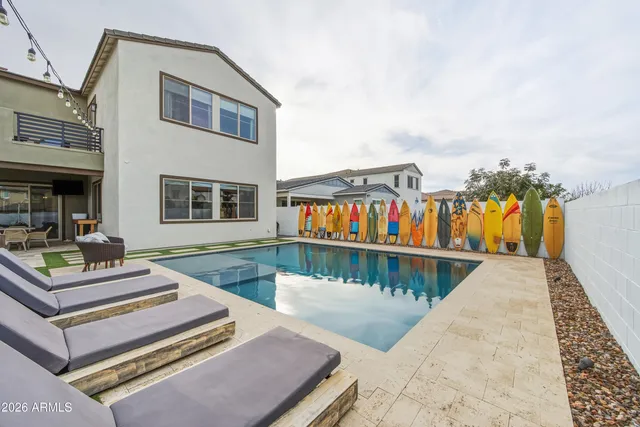 a view of a house with pool and windows
