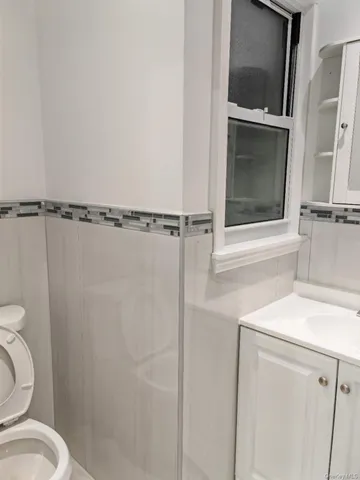 a bathroom with a toilet and a sink