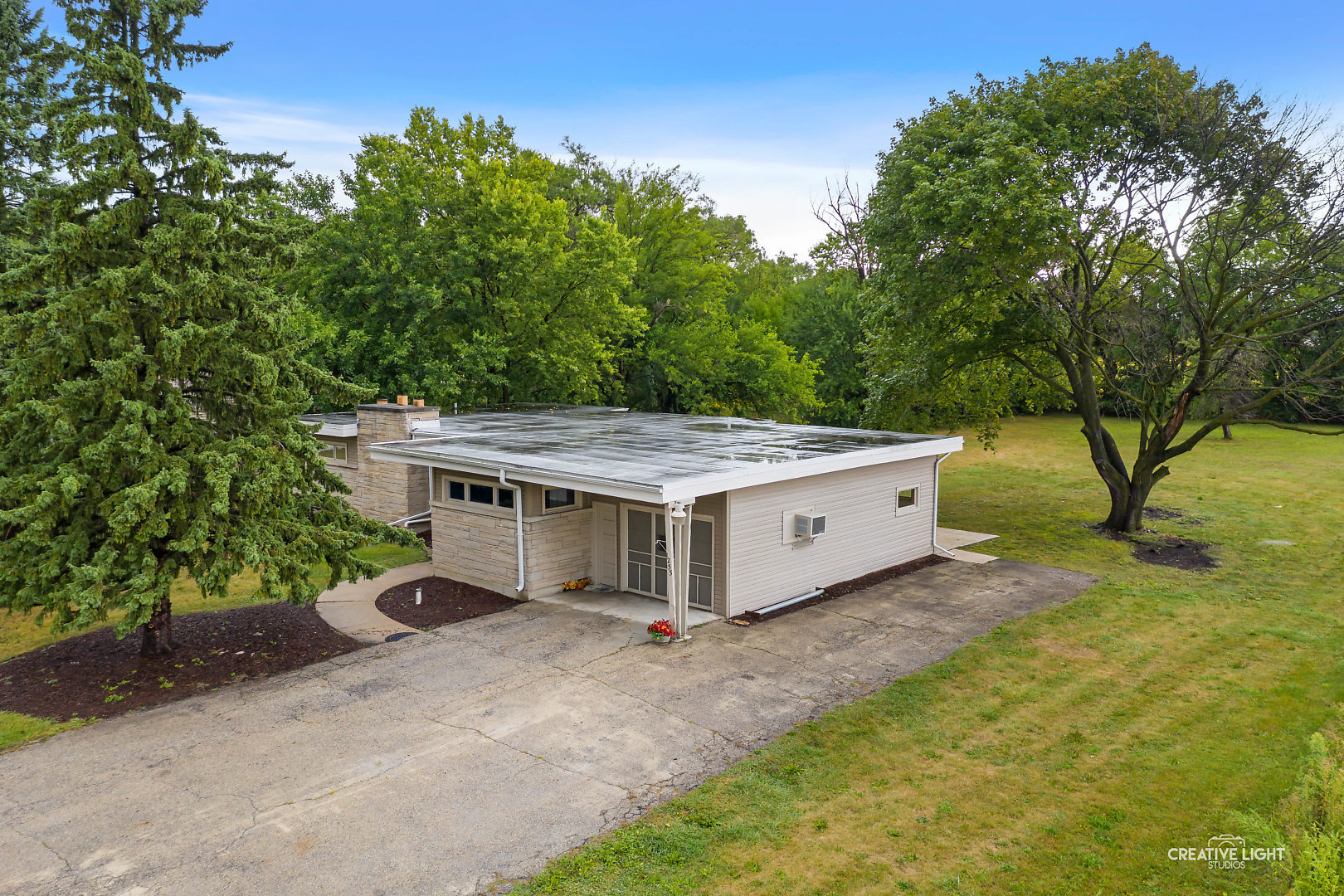 1255 North Randall Road Aurora, IL 60506 - Photo 2 of 39 a house with trees in front of it
