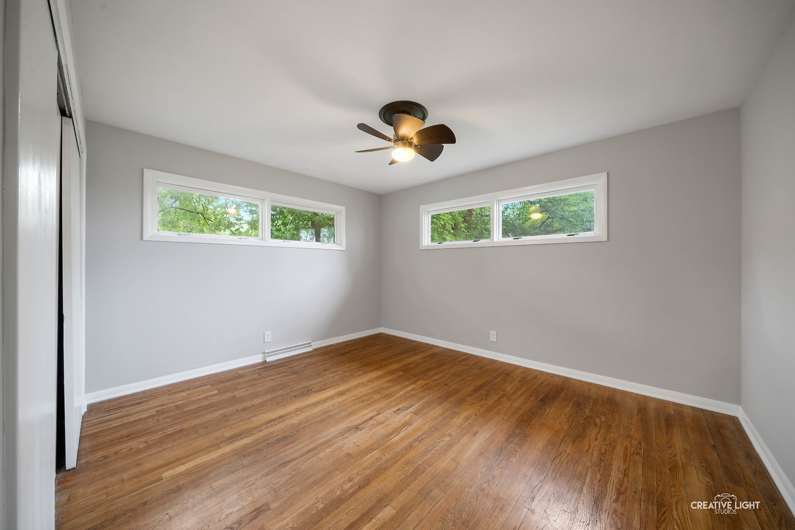 1255 North Randall Road Aurora, IL 60506 - Photo 18 of 39 wooden floor in an empty room with a window