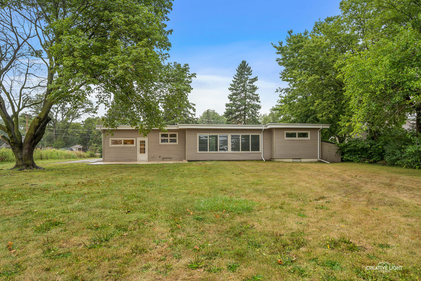 1255 North Randall Road Aurora, IL 60506 - Photo 32 of 39 a front of a house with a garden