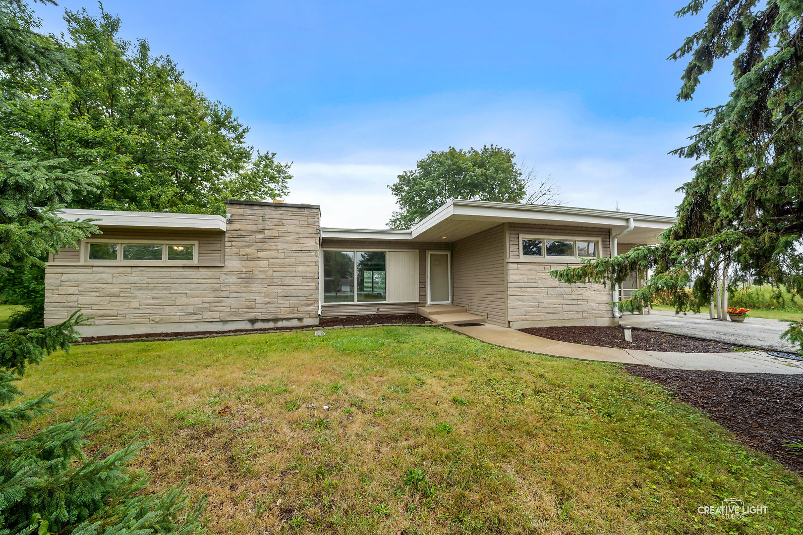 1255 North Randall Road Aurora, IL 60506 - Photo 5 of 39 a front view of a house with garden