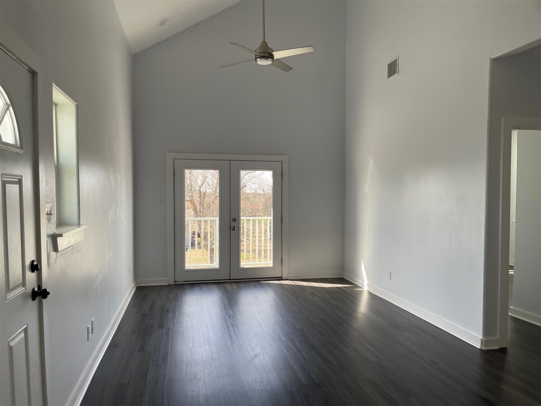 430 Schmidt Road, Unit A2 Sealy, TX 77474 - Photo 5 of 16 an empty room with wooden floor and windows