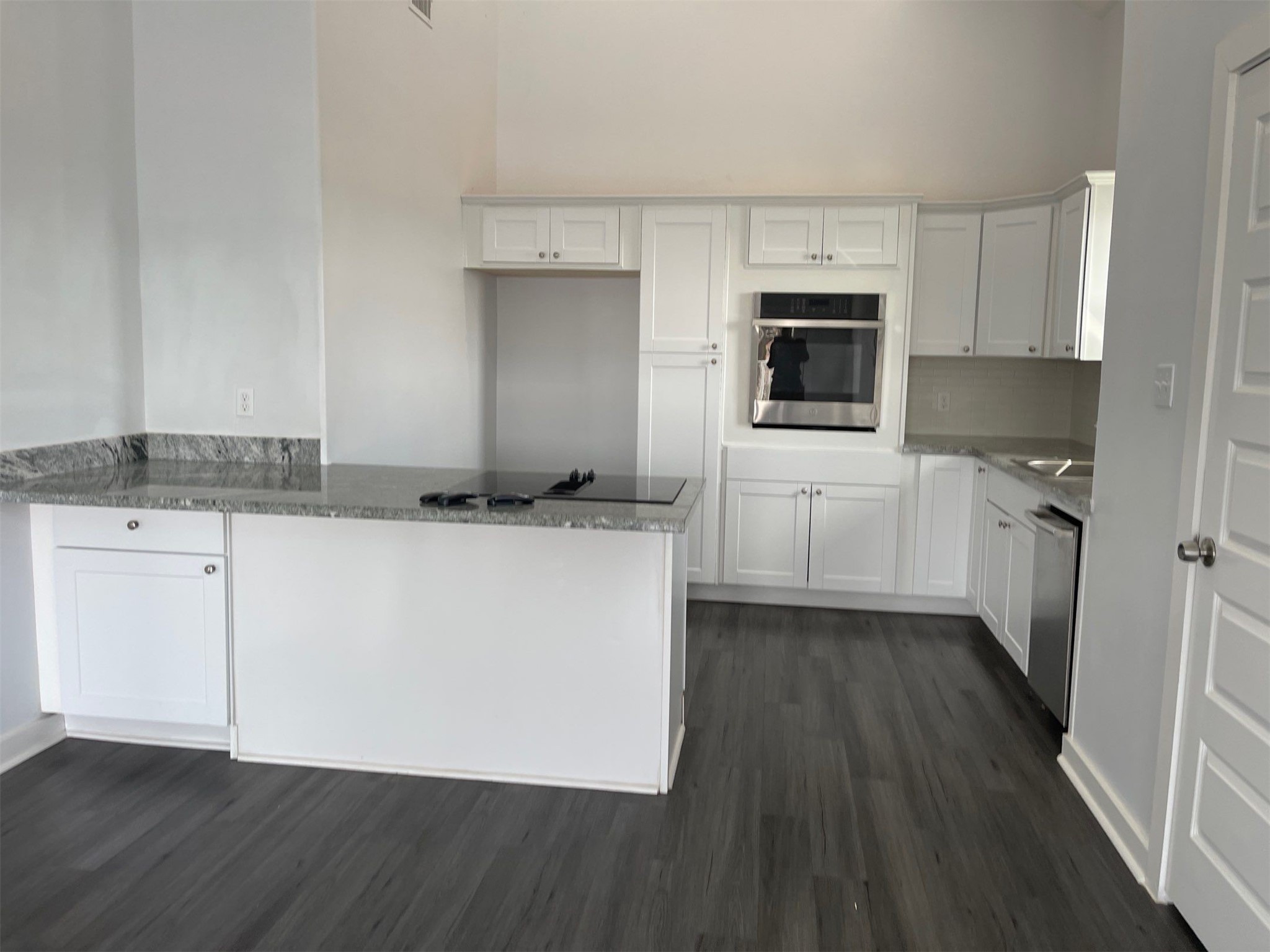 430 Schmidt Road, Unit A2 Sealy, TX 77474 - Photo 8 of 16 a kitchen with stainless steel appliances granite countertop a stove a sink and a microwave