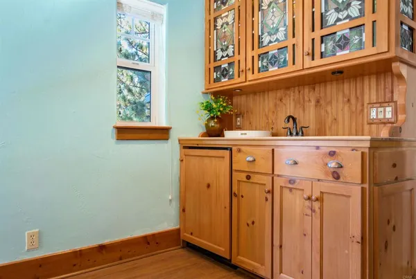 a bathroom with a sink and a window