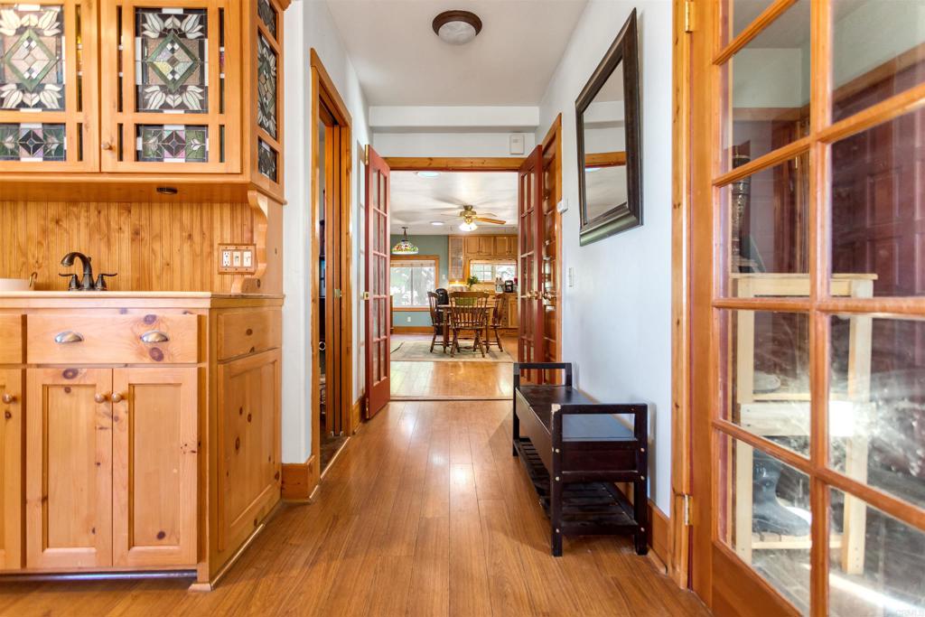 32787 Birch Hill Road Palomar Mountain, CA 92060 - Photo 14 of 44 a view of a hallway with wooden floor and dining room