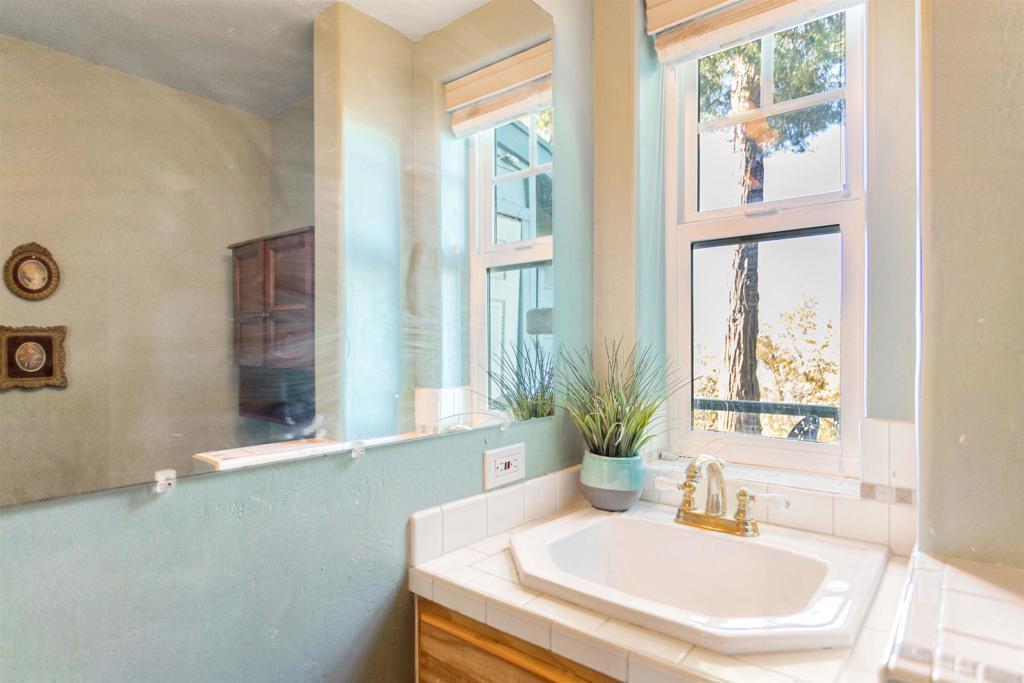 32787 Birch Hill Road Palomar Mountain, CA 92060 - Photo 15 of 44 a bathroom with a sink and a window